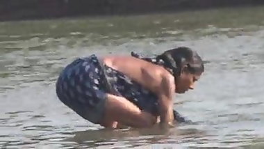 Indian women bathin in orissa village