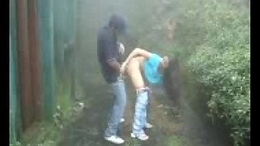 indian Lovers making-out in rain outdoor