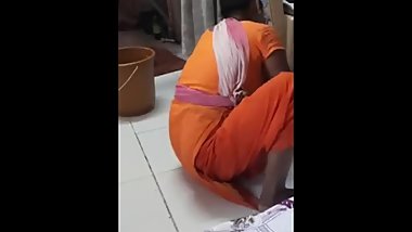 Indian maid shows clevage while sweeping