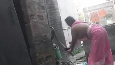 Voyeur - Indian BBW bathes outside