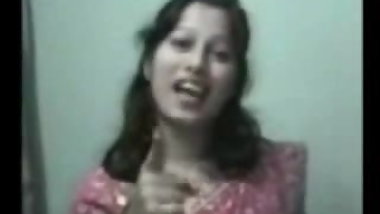 an indian lady taking her bath outside