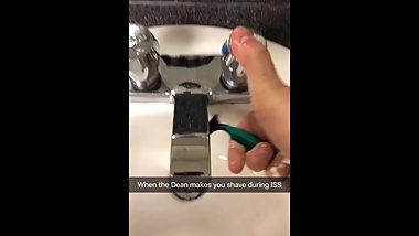Half-Indian teen strokes hairy beard with cream and a razor