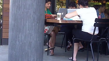 Candid double crossed legs by a sexy indian girl