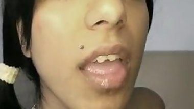 Pretty eyed Indian Suravinda takes a load in her mouth