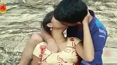 Boy pressing his girlfriend's boob
