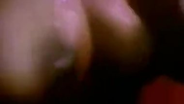 man putting honey on boobs and sucking them.....