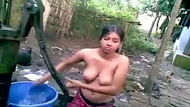 village girl bathing outdoor and took a self