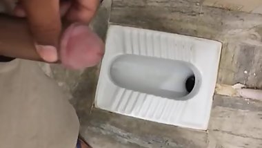 Indian teen caught  pissing in public toilet