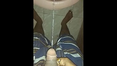 Indian guy warm pissing in toilet