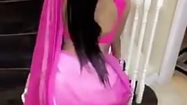 Twerking in her pink sari
