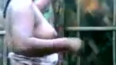 Indian Aunty's HUGE Boobs show while bathing