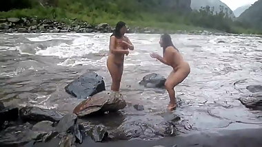 Two indian mature womens  bathing in river naked