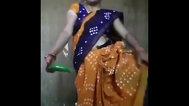 Aunty masturbates in saree with cucumber