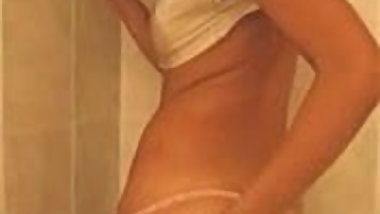 Indian teen applying oil over her body