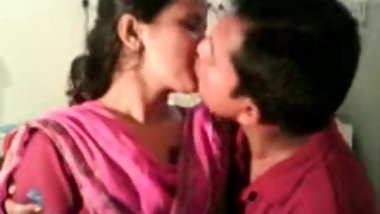 couple smooching and friend recorded