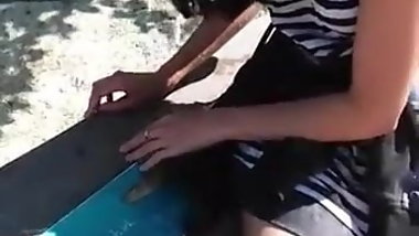 Indian girl in short dress sitting down nice legs