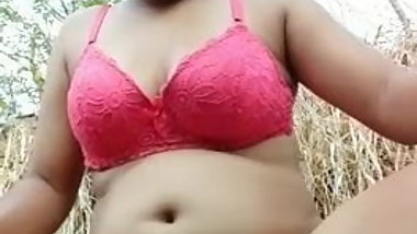 Indian woman enjoying in farm land...