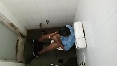 Guy mastubating in toilet with condom