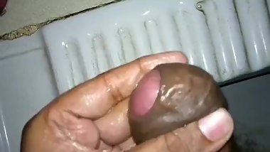 Horny teen indian boy playing with his dick in toilet craziness overloaded.